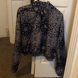 A large rue 21 wind breaker crop top very cute.